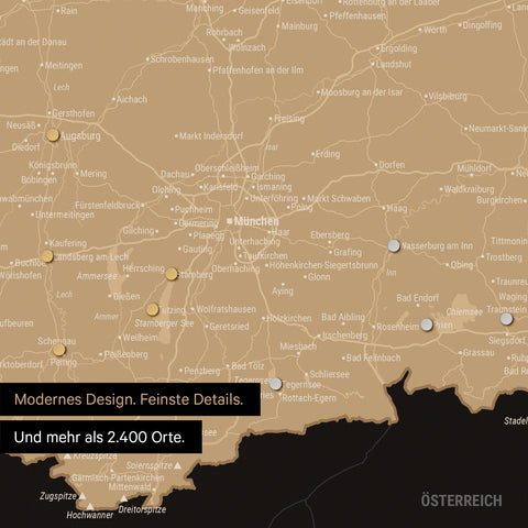 Ausschnitt einer magnetischen Deutschland-Karte in Sonar Black zeigt Karte von Bayern, auf der Magnete Reiseziele markieren