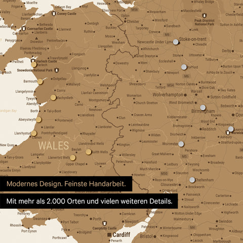 Close-up of a magnetic England & Ireland map with magnets marking numerous travel destinations