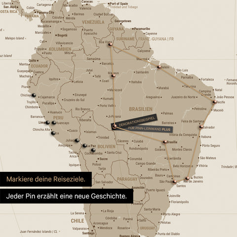 Detail of a world map in the Equal Earth projection as a Push Pin Map in Desert Sand, showing a pinned travel route through South America via Brazil, Peru, and Ecuador