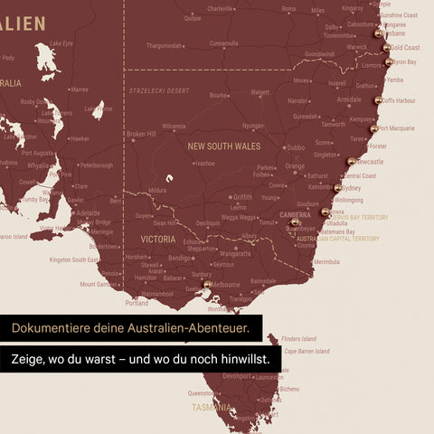 Ausschnitt einer Landkarte von Australien in Farbe Bordeaux Rot mit Pins zur Markierung von besuchten Reisezielen