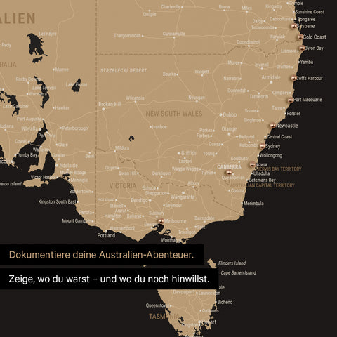 Ausschnitt einer Landkarte von Australien in Farbe Sonar Black (Schwarz-Gold) mit Pins zur Markierung von besuchten Reisezielen