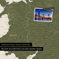 Section of a map of Wales and England in Olive Green, with pins marking visited travel destinations