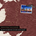 Section of a map of Wales and England in burgundy red with pins marking visited travel destinations