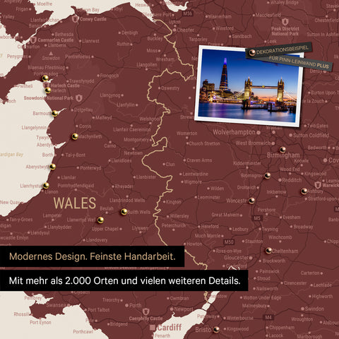 Section of a map of Wales and England in burgundy red with pins marking visited travel destinations
