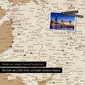 Close-up of a colorful map of Wales and England in Treasure Gold with pins marking visited travel destinations