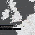 Pins stecken in einer Europa Landkarte in der Farbe Dunkelgrau und markieren Reisezielen 