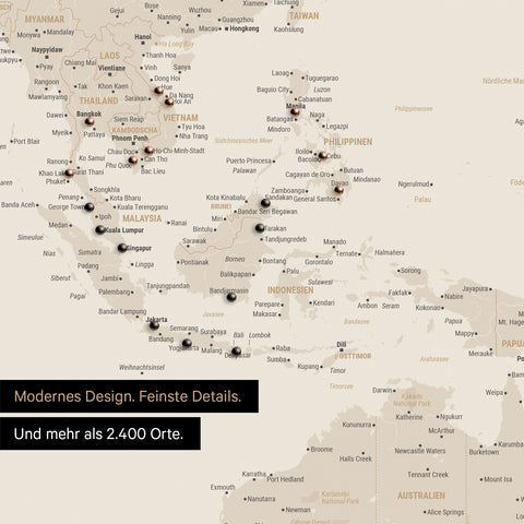Ausschnitt einer Weltkarte in Gold zeigt Karte von Südost-Asien mit Pins von besuchten Reisezielen