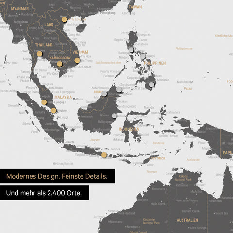 Ausschnitt einer magnetischen Weltkarte in Light Gray zeigt Karte von Asien, auf der Magnete Reiseziele markieren
